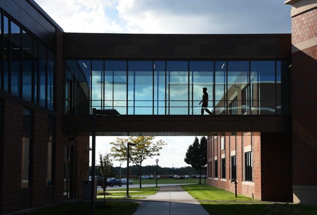 Student walking through building